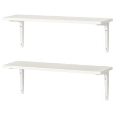 two white shelves sitting next to each other