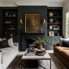 a living room with two couches and a coffee table in front of a fireplace