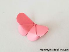 an origami butterfly sitting on top of a table