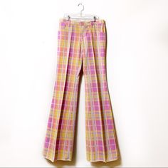 1970’s New With Tags (Vintage But Unworn) Low Rise Plaid Bell Raw Hem Bottom Pants. Mid-Weight Woven Polyester Fabric. In Excellent New Vintage Condition, New And Unworn. Size On Tag 26 Over Writing (See Photo) Care/Import 100% Polyester Cold Wash, Hang To Dry Made In U.S.A. Approximate Measurements Laying Flat Waist: 16” Hips: 20” Rise: 9.5” Inseam: 36” (Raw Hem) Coachella Festival Style, Original Bohemian 70s Flare Pants Spring Vintage Full Length Pants, Vintage Wide Leg Yellow Pants, Vintage Pink Wide Leg Pants, Fitted 70s Inspired Summer Pants, Vintage Wide Leg Yellow Bottoms, Vintage Yellow Wide-leg Bottoms, Vintage High Waist Yellow Bottoms, Vintage High-waist Yellow Bottoms, Fitted 1970s Style Pants For Spring