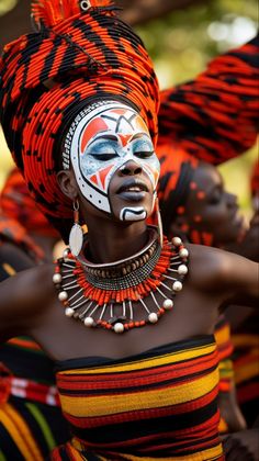 an african woman with painted face and headdress