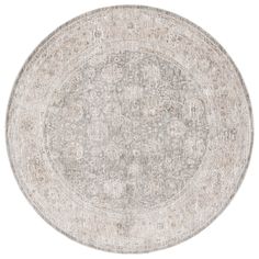 a round rug with an intricate design in grey and beige colors on a white background