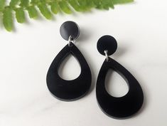 "These earrings are made from shiny black resin. They hang from handmade sterling silver ear wires and measure just over 1.5\" long and 1\" wide." Cheap Black Resin Earrings, Black Resin Dangle Jewelry, Black Resin Drop Earrings, Elegant Black Resin Earrings, Minimalist Black Long Drop Earrings, Nickel-free Black Long Drop Earrings, Nickel Free Black Long Drop Earrings, Handmade Black Long Drop Earrings, Black Drop Earrings For Gift