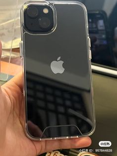 someone is holding an iphone in their hand with the case on it's side