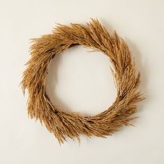 a dried wheat wreath on a white background