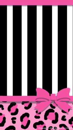 a pink and black leopard print box with a bow on it's side, in front of a striped background