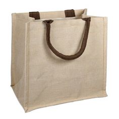 a canvas bag with brown handles on a white background