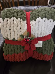 two christmas blankets stacked on top of each other