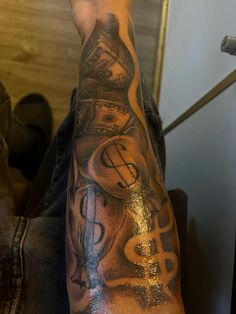 a man's arm with music notes and musical symbols on it, while he is sitting down