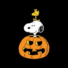 a cartoon dog sitting on top of a pumpkin