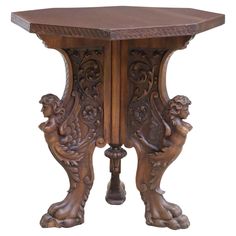 an ornate wooden table with carvings on it