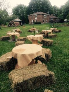 hay bales are arranged around a table in the yard