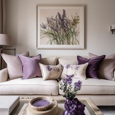 a living room filled with lots of furniture and pillows on top of a coffee table