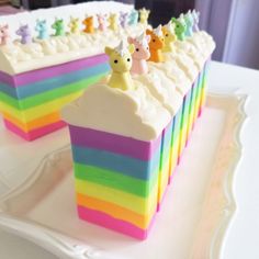 there is a cake decorated with rainbows and bears on it