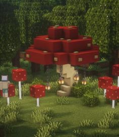 a bunch of red boxes sitting on top of a lush green field next to trees