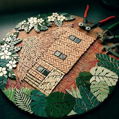 a wooden table topped with lots of different types of tools and decorations on top of it