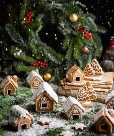 gingerbread houses and christmas decorations on a table