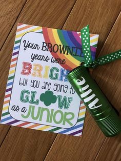 a card that says, your brownie years were bright but you're going to glow as a junior