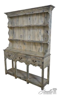 an old wooden cabinet with drawers and shelves