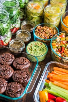 a table topped with lots of different types of salads and desserts on top of it