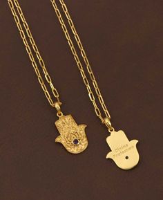 Explore the fusion of spiritual symbolism and artistic design with the 18K gold plated brass necklace, featuring an exquisitely crafted hamsa hand pendant. This ancient symbol, renowned for its protective qualities, is intricately embossed, showcasing a level of craftsmanship that brings depth and texture to the design. Adding to its allure, the pendant is adorned with a small, elegantly studded gemstone, available in three captivating options: the tranquil Amethyst, the mystical Labradorite, an Handmade Gold Star Of David Necklace, Gold Evil Eye Jewelry For Blessing, Gold Star Of David Amulet Necklace, Traditional Gold Evil Eye Necklace, Handmade Spiritual Gold-plated Charm Necklaces, Hamsa Hand Necklace, Buddha Groove, Divine Protection, Spiritual Necklace