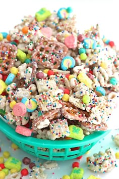 a blue bowl filled with cereal and sprinkles