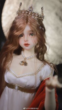 a doll with long hair wearing a tiara