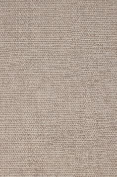 a beige rug with small squares on it