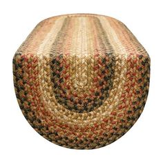 a round rug with red, black and tan designs on it's sides is shown in front of a white background