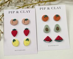 two pairs of fruit and vegetable studs are shown in front of a white background