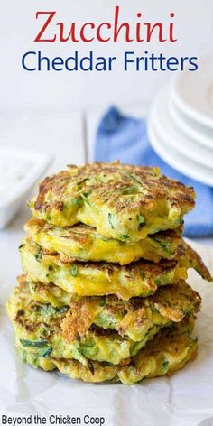 zucchini cheddar cakes are stacked on top of each other