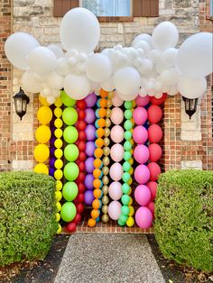 an entrance decorated with balloons and streamers