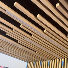 the inside of a building with wooden slats