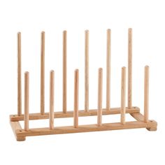 a wooden rack with several sticks sticking out of it's sides and the bottom