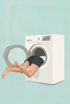 a person is hanging upside down from a washing machine