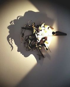 the shadow of a clock is cast on the wall