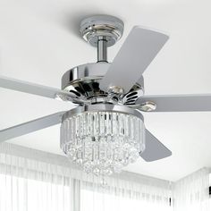 a ceiling fan with crystal chandelier hanging from it