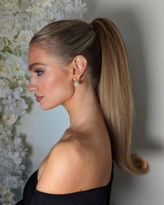 Rachel | Calgary Bridal Hair on Instagram: "Sleek Barbie Pony for the Feed🫶🏻  Chic, Secure, and oh so Snatched thanks to…  @kenraprofessional texturizing Taffy  @schwarzkopfpro Osis 2 and powder  And @moroccanoilpro texturizing spray   The go to Rehearsal Dinner or Reception Party hair for your 2024 wedding 💍  Accessorized with @joannabisleydesigns  earrings  Model (the stunning) @julia.vlodova   On the new RJStyles floral back drop 🤤  #yyc #yycbride #yychair #yycbride #albertabride #albertawedding #haireducation #canadianhairstylist #ponytail #oneshot #btconeshot24_specialeventstyling #beyondtheponytail #weddinghairinspo #weddinghairideas" Wedding Guest Hair High Ponytail, Slick Ponytail Wedding Hair, Slick Ponytail Updo, Ponytail Wedding Guest Hairstyles, Blowout Hair Ponytail, Bridal Ponytail With Bow, Slick Bridesmaid Hair, Event Ponytail Hairstyles, Bridal Hair High Ponytail