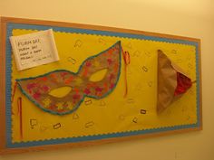 a bulletin board with two masks on it