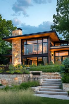 a modern house with stone steps leading up to it