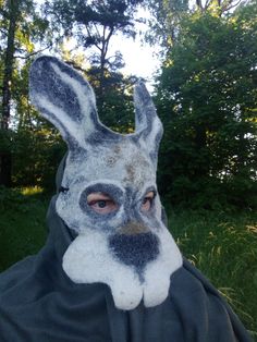 An original hare mask with long ears and teeth for lovers of transformation and fun. Unisex hare mask. The ears are 17-20 cm long. The mask is made of Latvian wool and merino wool with the addition of viscose and linen fibers on gauze. The mask is made using a flat template, after which it is given a three-dimensional shape. The mask is made by wet felting from wool with water and soap. On the mask I drew the face and ears of a hare using wool and fibers. At the end of the work, I gave the mask Hare Mask, Mask Theater, Carnival Parties, Animal Cosplay, Bunny Mask, Three Dimensional Shapes, Animal Mask, Carnival Mask, Scary Mask