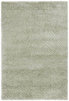 an area rug with diamond pattern in light green