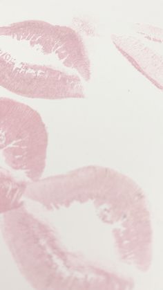 pink lipstick prints on a white background