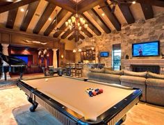 a pool table in the middle of a living room