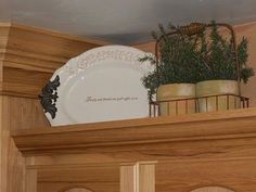 there is a white plate on top of the mantle