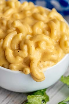 a white bowl filled with macaroni and cheese