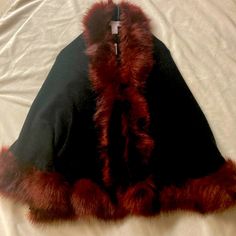 Nwt Adrienne Vittadini Black Cape Completely Edged In Burgundy Fur Fitted Fall Cape For Evening Wear, Black Fitted Winter Cape, Fitted Black Winter Cape, Fitted Long Sleeve Winter Cape, Elegant Fall Cape For Cold Weather, Elegant Black Winter Cape, Fitted Long Sleeve Cape For Winter, Chic Fitted Winter Cape, Winter Formal Fitted Cape