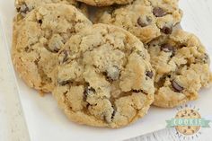 a pile of cookies sitting on top of a black plate