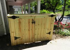 a wooden gate in front of a house