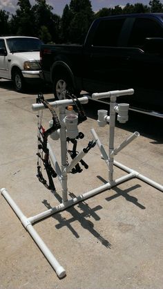 a car is parked in the parking lot next to a rack with multiple objects on it